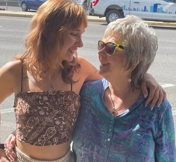 Haile with her grandmother, sharing a close moment outdoors